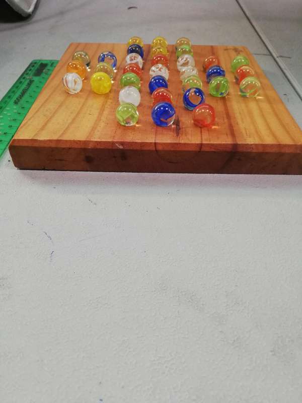 Marbles on pine board decor