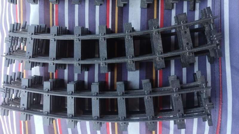 Lot of strong, metal train tracks. Inside track is 32mm(3.2cm). Outside track: 36mm(3.6cm).