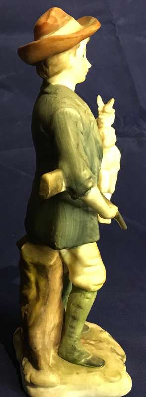 Vintage boy with rabbit figurine