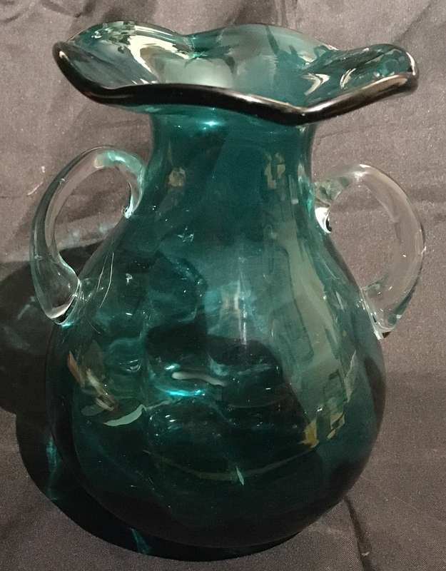 Green glass vase with ruffled edge