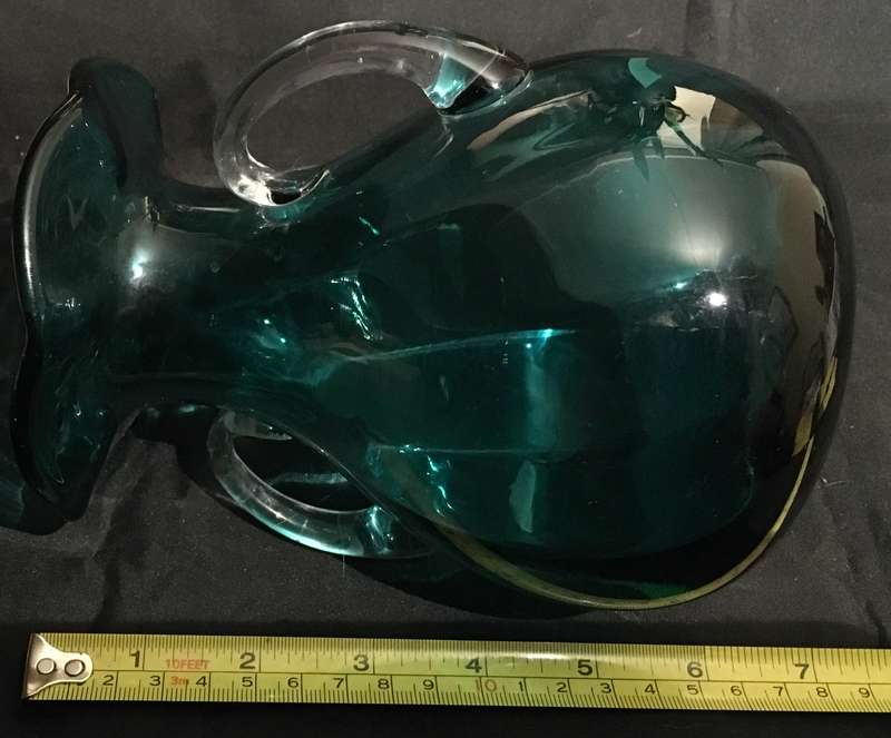 Green glass vase with ruffled edge