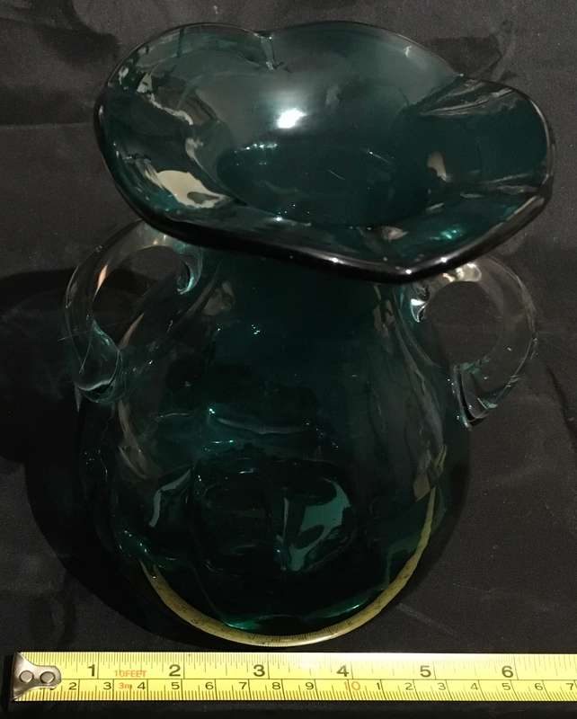 Green glass vase with ruffled edge