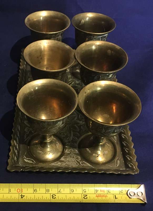 Brass egg cups (6) on a tray. Vintage