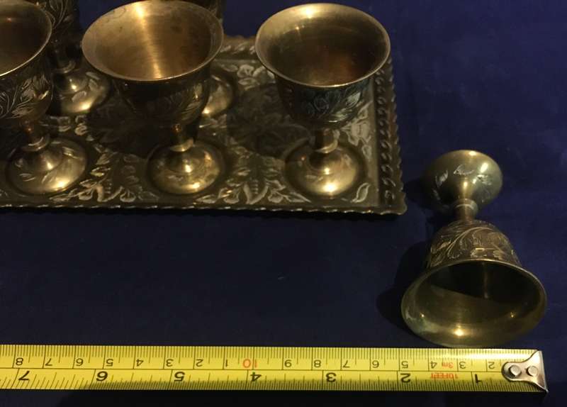 Brass egg cups (6) on a tray. Vintage