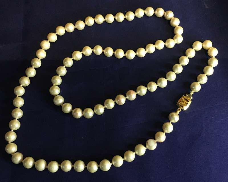 Faux single strand pearls