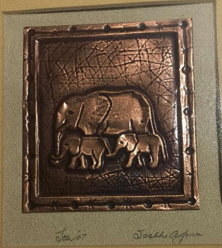 Portrait of mother and babies elephants on a copper plate