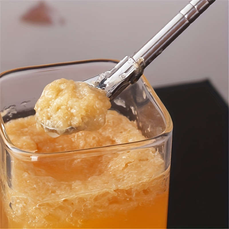 A Set Of Three Stainless Steel Straw Spoon