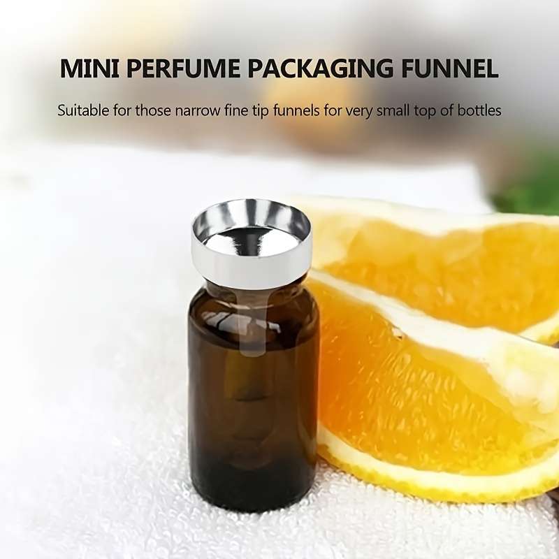 A Set Of Small Golden Funnels Specially Designed For Perfumes And Essential Oils