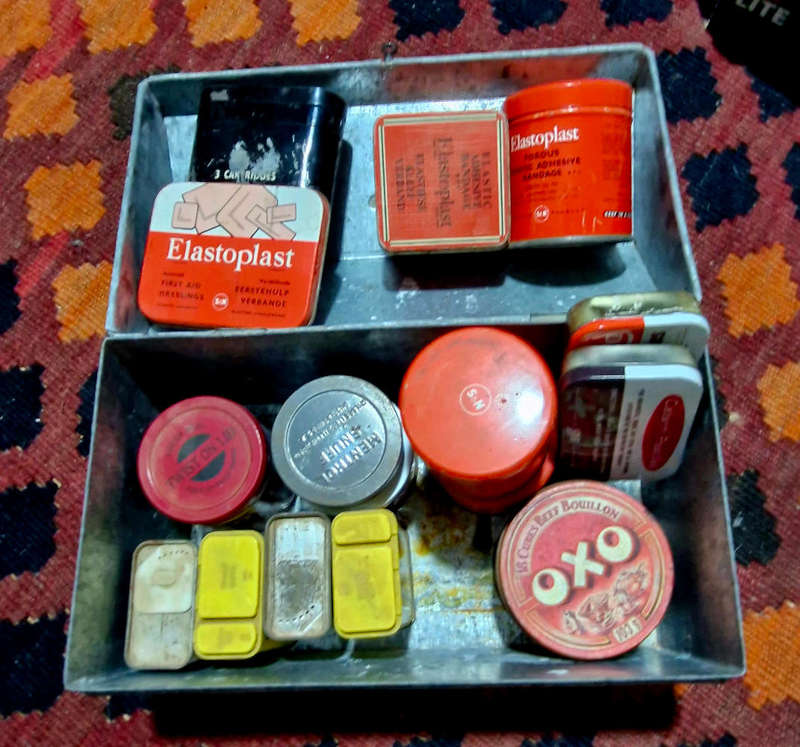 Tin trunk filled with small vintage tins