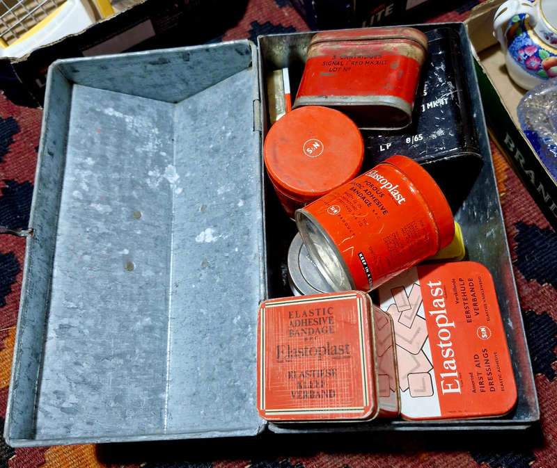 Tin trunk filled with small vintage tins