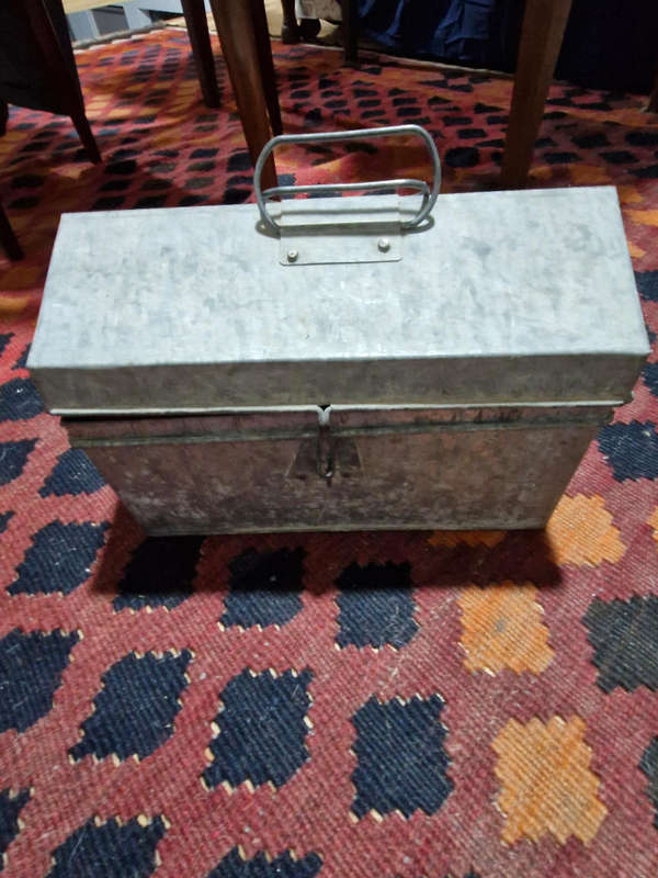 Tin trunk filled with small vintage tins