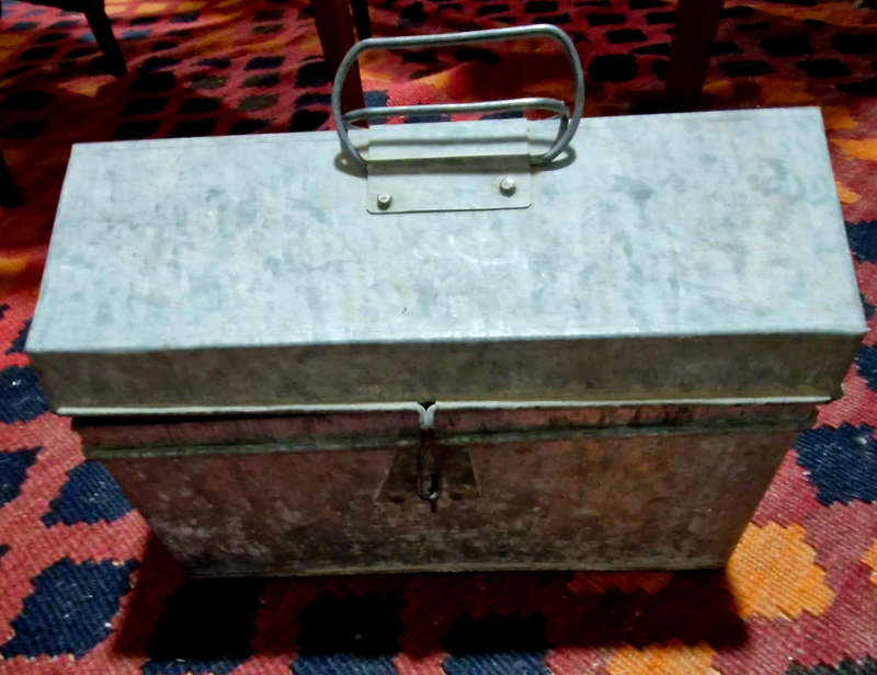 Tin trunk filled with small vintage tins