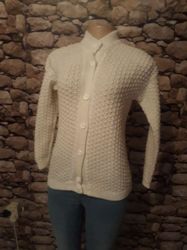 White knitted cardigan with high ribbed neck.Button down.Acrylic knit.Size 30/6 -13 to 14 year
