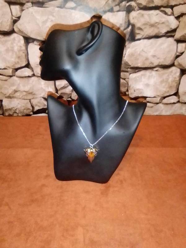 A Trendy And Delicate Necklace With A Heart-shaped Angel Wing Pendant