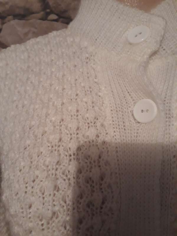 White knitted cardigan with high ribbed neck.Button down.Acrylic knit.Size 30/6 -13 to 14 year