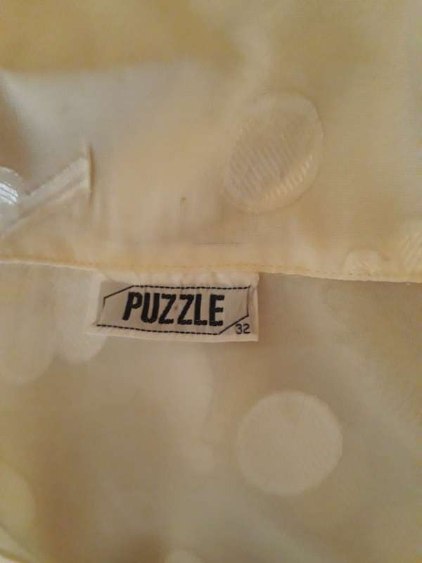 IVORY COLOUR SHEER TOP BY PUZZLE IN SIZE 8/32/S - POLYESTER CHIFFON WITH EMBOSSED FLORAL PATTERN