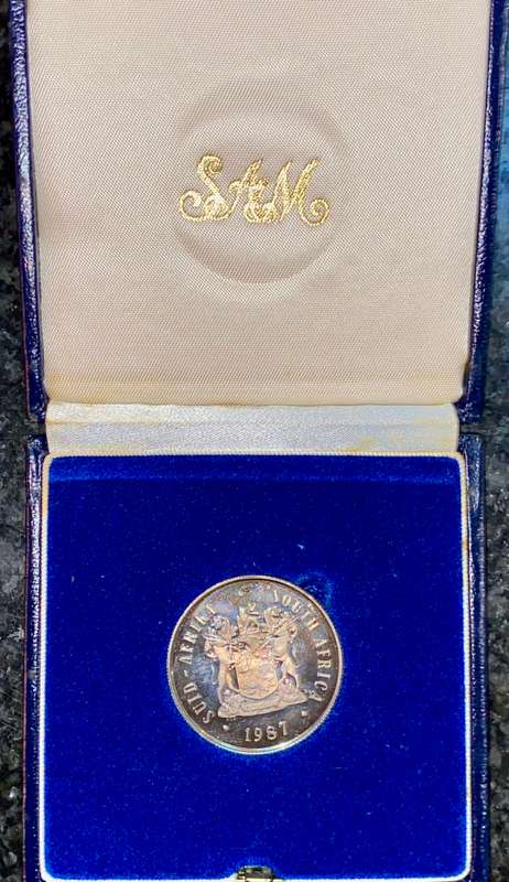 South Africa Proof silver R1 -- 1987 black toning - blue SA mint box