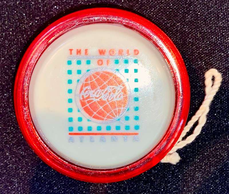 VINTAGE GENUINE COCA COLA RUSSELS SPINNER - THE WORLD OF ATLANTA - FIBERGLASS RIM GOOD CONDITION