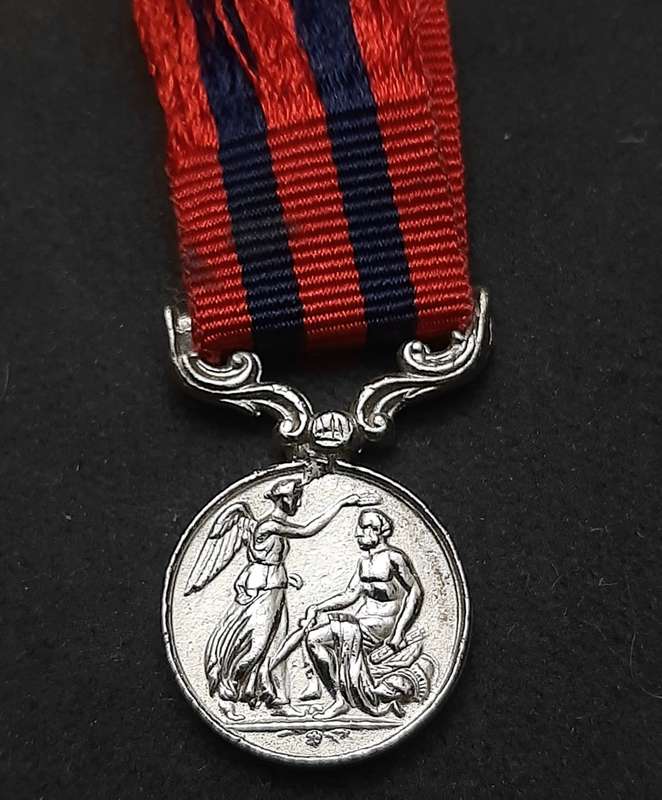 **British Army: Repro. QV 1854 India General Service Miniature Medal w/ Ribbon.**
