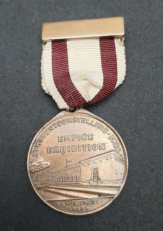 **1936 South Africa : Empire Exhibition Bronze Medallion w/ Silk Ribbon EF. (Pin Intact).**