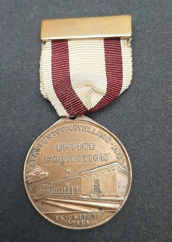 **1936 South Africa : Empire Exhibition Bronze Medallion w/ Silk Ribbon EF. (Pin Intact).**