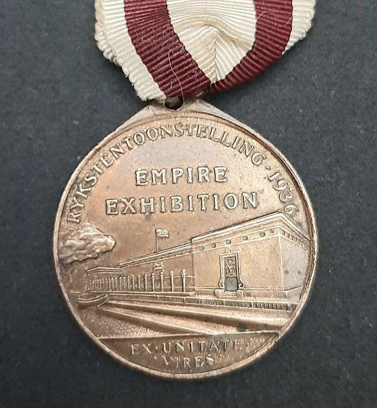 **1936 South Africa : Empire Exhibition Bronze Medallion w/ Silk Ribbon EF. (Pin Intact).**