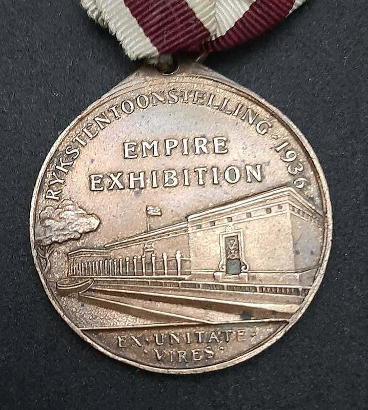 **1936 South Africa : Empire Exhibition Bronze Medallion w/ Silk Ribbon EF. (Pin Intact).**