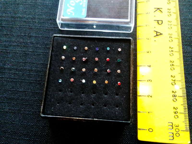 Collection of Twentyfour Nose Studs - 31 L Surgical Steel - Good Condition