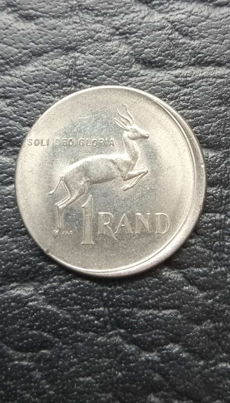 1977 R1 coin, damaged during minting
