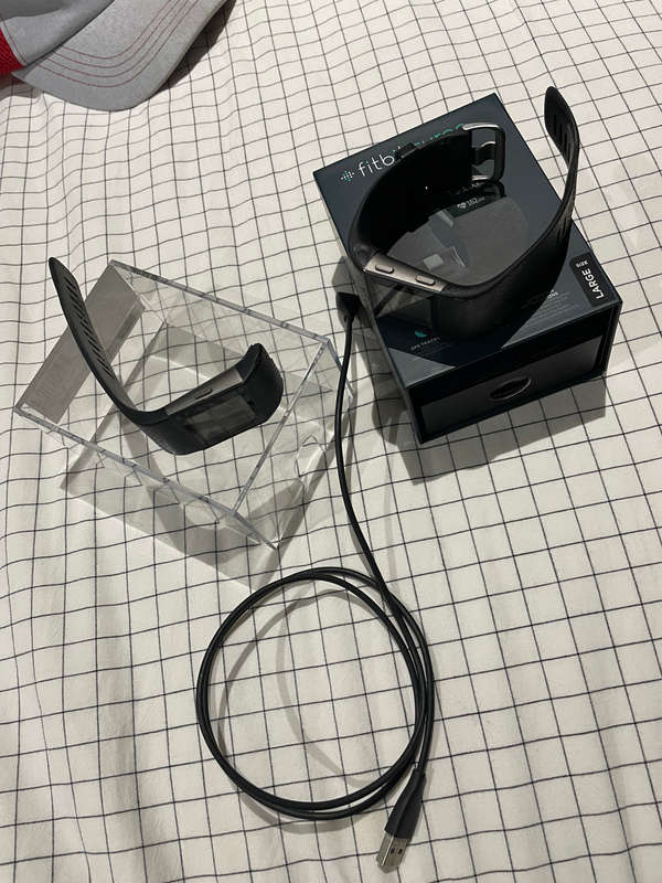 Two Fitbit Surge watches Large