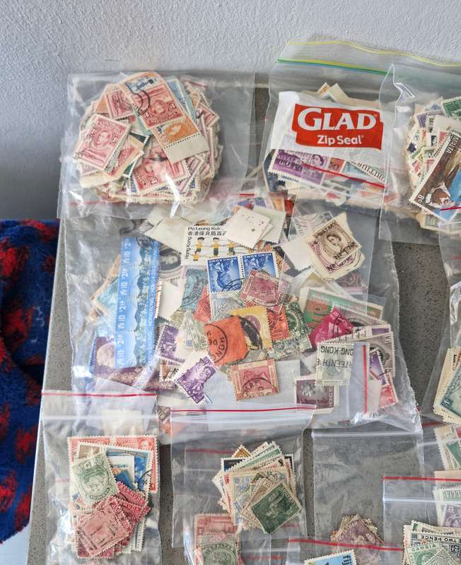 Over 50 British Colonial semi sorted stamp packs including 15 packs containing Queen Victoria stamps