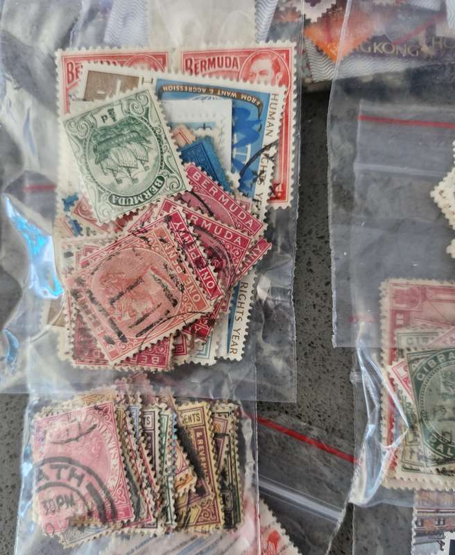 Over 50 British Colonial semi sorted stamp packs including 15 packs containing Queen Victoria stamps