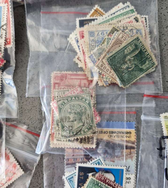 Over 50 British Colonial semi sorted stamp packs including 15 packs containing Queen Victoria stamps