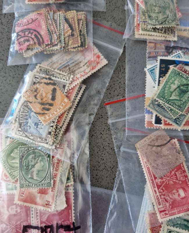 Over 50 British Colonial semi sorted stamp packs including 15 packs containing Queen Victoria stamps