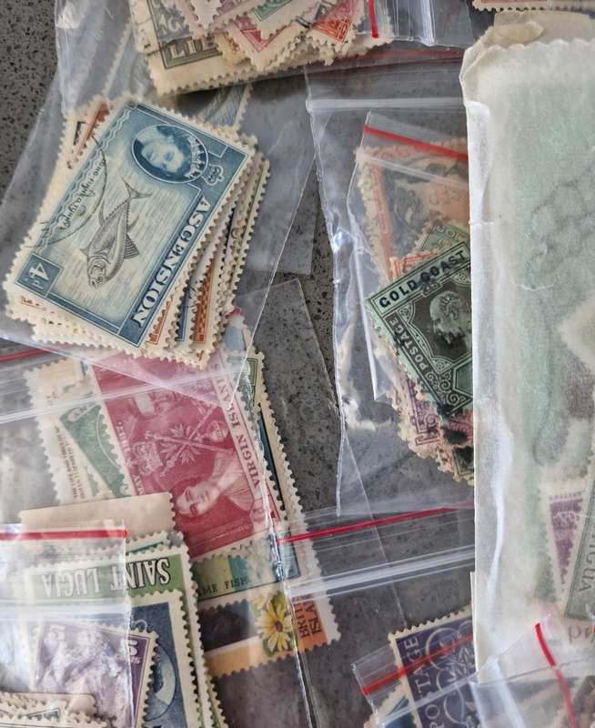 Over 50 British Colonial semi sorted stamp packs including 15 packs containing Queen Victoria stamps