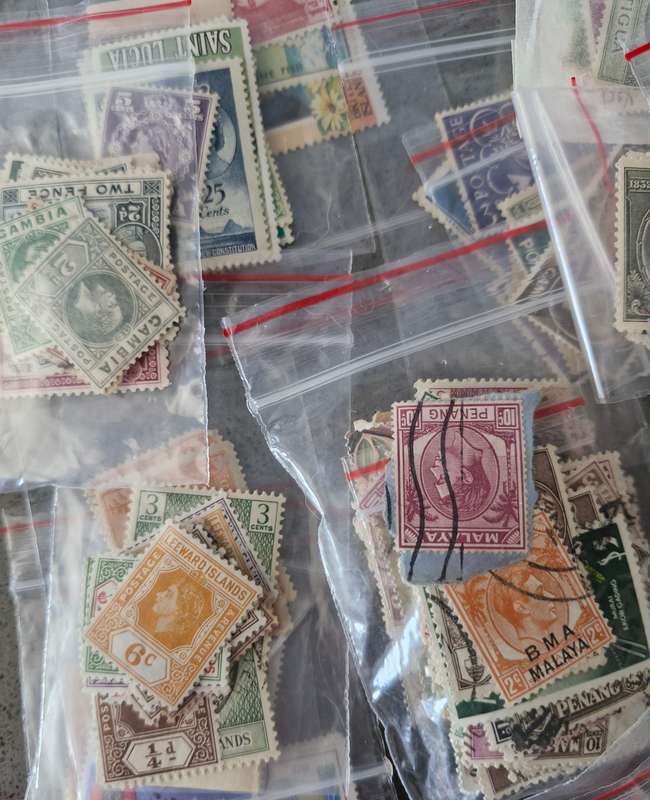 Over 50 British Colonial semi sorted stamp packs including 15 packs containing Queen Victoria stamps