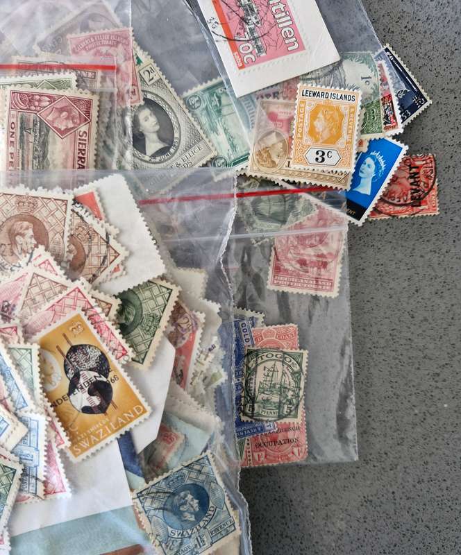 Over 50 British Colonial semi sorted stamp packs including 15 packs containing Queen Victoria stamps