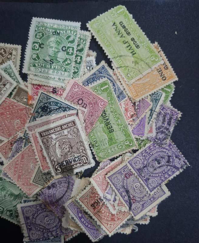 Packet of stamps from India including Queen Victoria, 3 British Kings, Service & official stamps etc