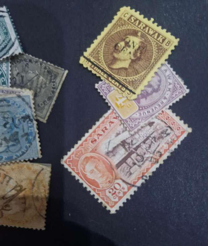 Packet of stamps from India including Queen Victoria, 3 British Kings, Service & official stamps etc