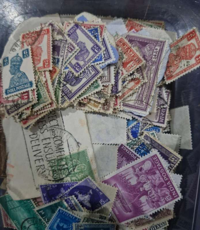 Packet of stamps from India including Queen Victoria, 3 British Kings, Service & official stamps etc