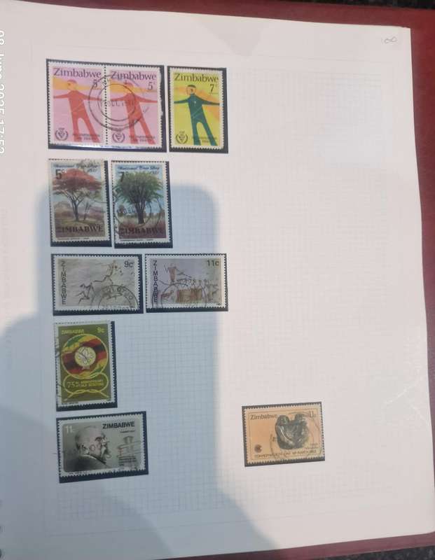 Stamp album with approx. 60 pages of worldwide stamps from 1800s to more current.