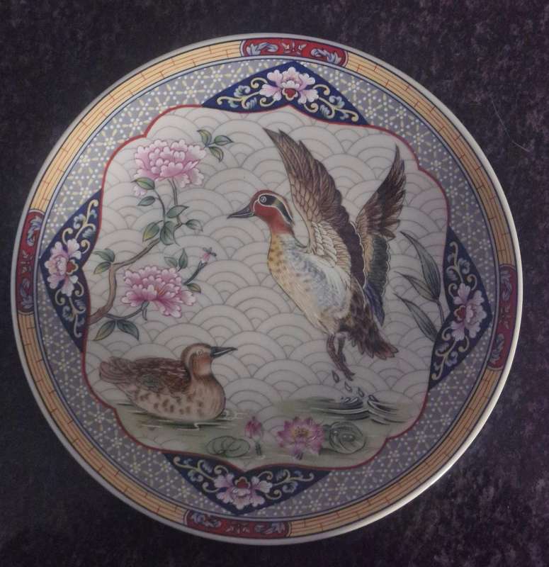 Set of 4 oriental plates/bowls, all with makers marks/label.