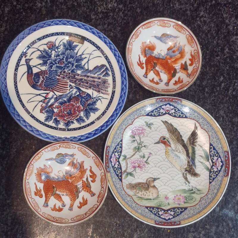 Set of 4 oriental plates/bowls, all with makers marks/label.