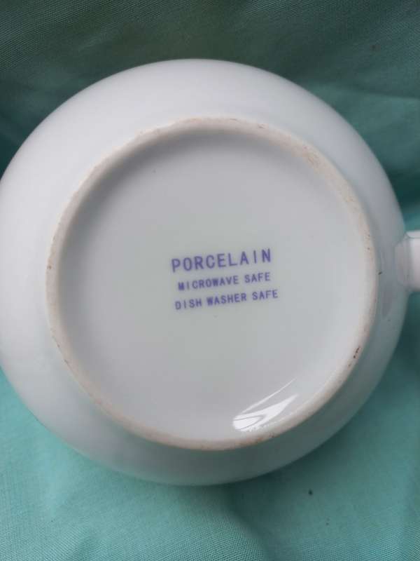Porcelain teapot andcup and sauser