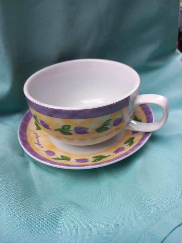 Porcelain teapot andcup and sauser