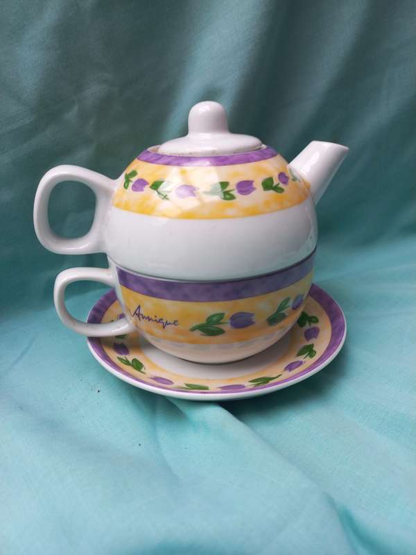 Porcelain teapot andcup and sauser