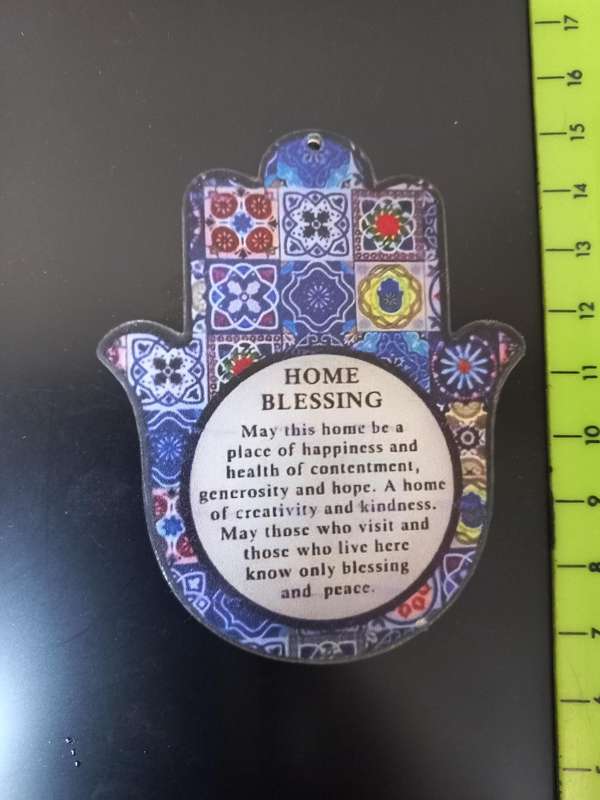 Open hand with 'HOME BLESSING"  in palm