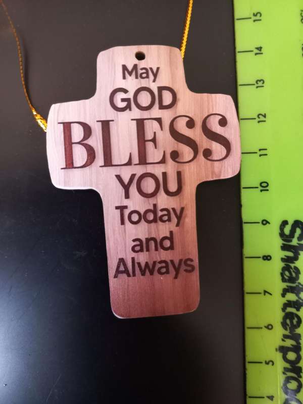 Cross with " MAY GOD BLESS YOU Today and Always" written on it
