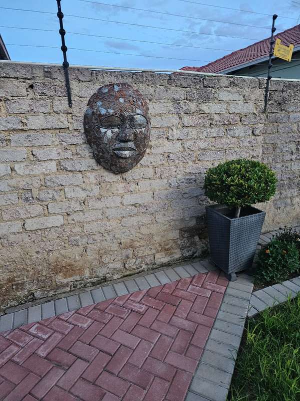 Metal Mask Sculpture