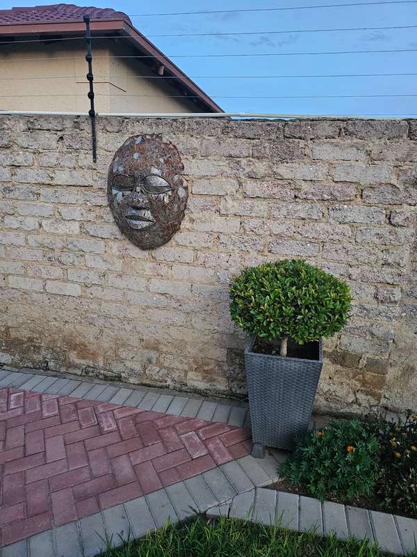 Metal Mask Sculpture